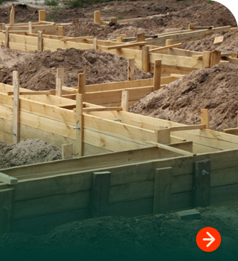 Wood concrete forming panels installed at a construction site