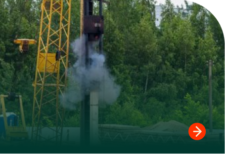 Crane pile driving equipment in use at construction site